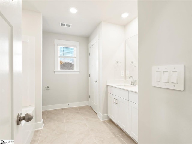 bathroom with vanity and tile patterned flooring