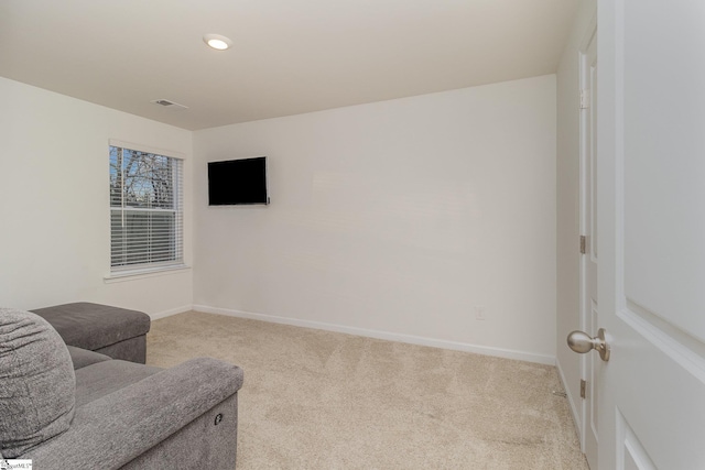 living area with light colored carpet