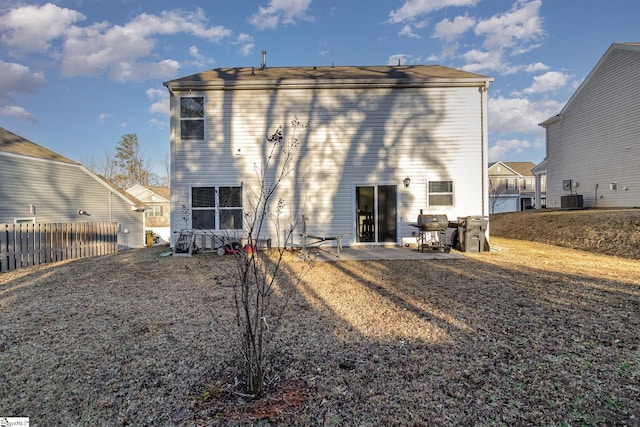 back of property featuring cooling unit and a patio area