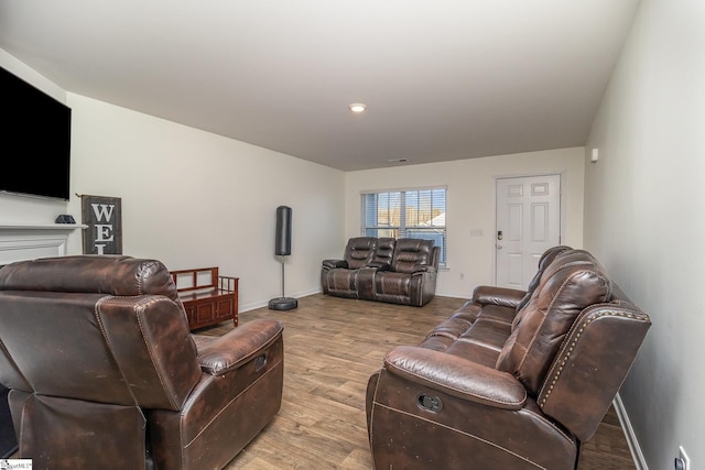 living room with light hardwood / wood-style flooring