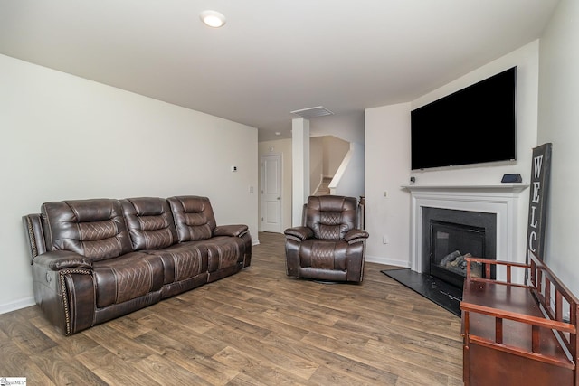 living room with dark hardwood / wood-style flooring