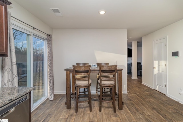 dining area with dark wood-type flooring