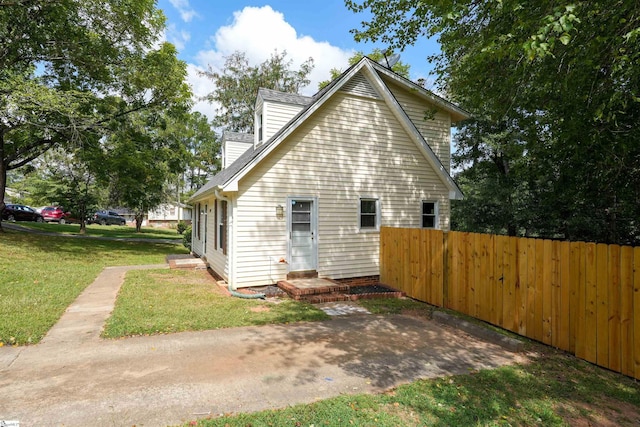 view of home's exterior featuring a yard