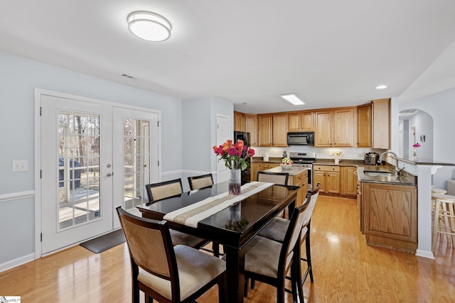 dining room featuring light hardwood / wood-style floors and sink