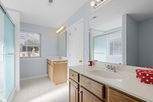 bathroom featuring walk in shower and vanity