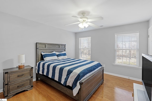 bedroom featuring ceiling fan and light hardwood / wood-style flooring