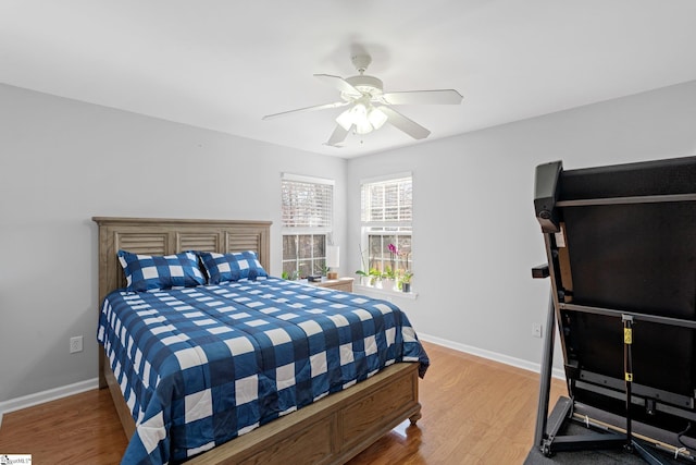 bedroom with hardwood / wood-style floors and ceiling fan