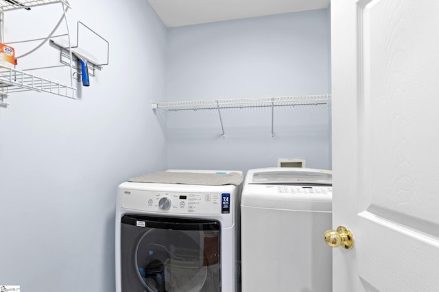 washroom with washing machine and dryer