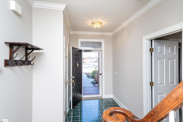 tiled foyer entrance featuring crown molding