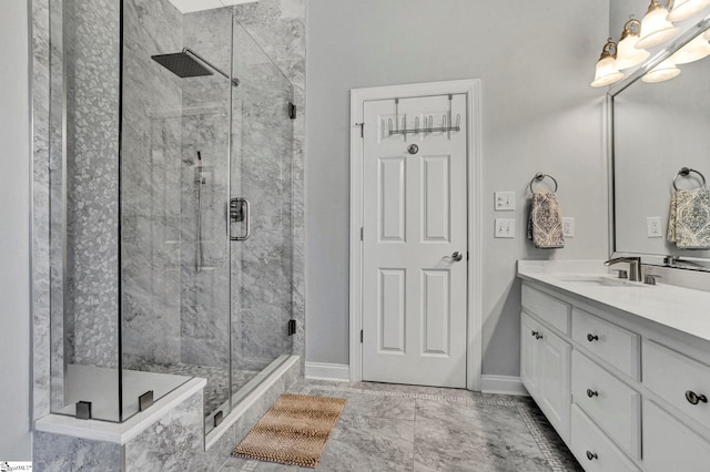 bathroom with vanity and a shower with shower door