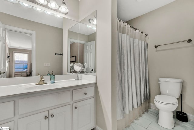 bathroom with toilet, vanity, and a shower with curtain