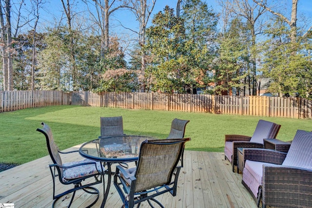 wooden terrace with a lawn