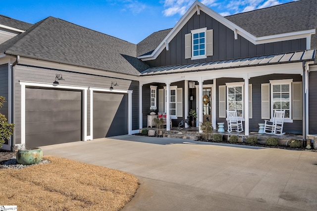 view of front of house with a porch and a garage