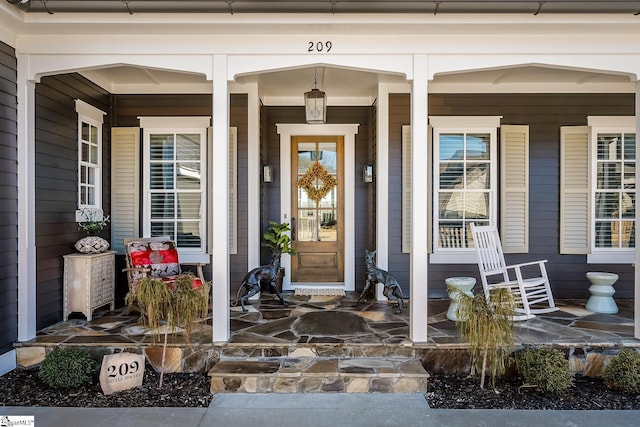 property entrance featuring a porch