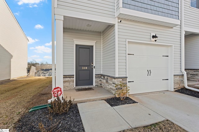 entrance to property featuring a garage