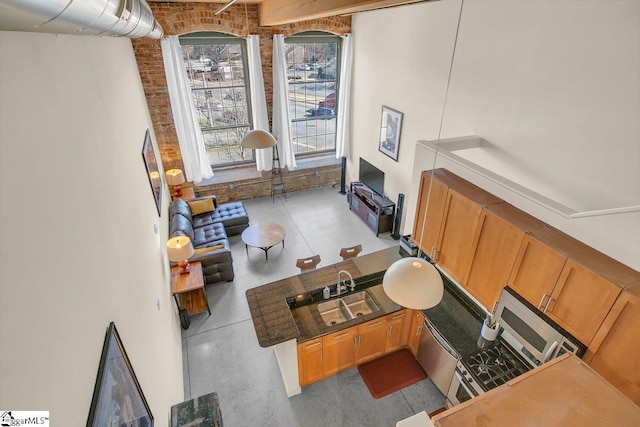 living room featuring brick wall and sink