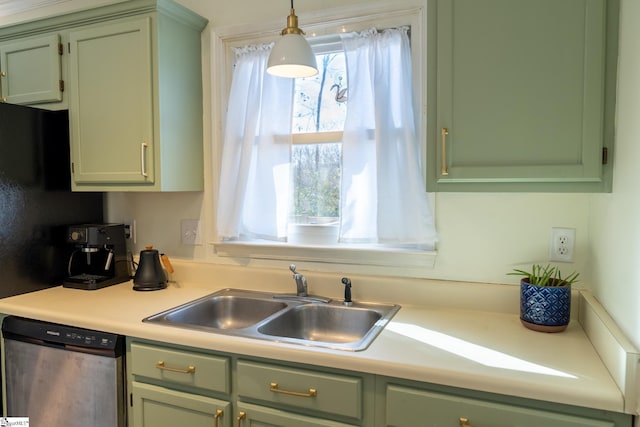 kitchen featuring sink, green cabinets, dishwasher, and pendant lighting