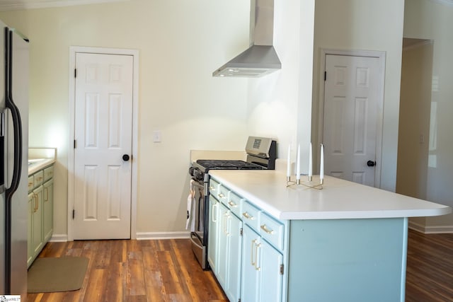 kitchen with appliances with stainless steel finishes, dark wood-type flooring, wall chimney range hood, and kitchen peninsula