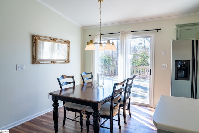 dining space featuring crown molding and dark hardwood / wood-style floors