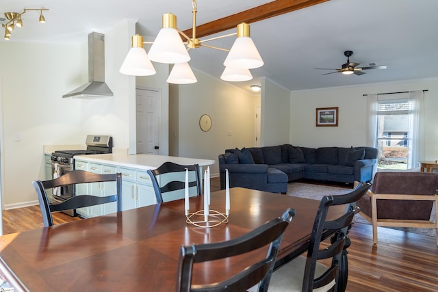 dining space with ceiling fan, dark hardwood / wood-style flooring, ornamental molding, and beamed ceiling