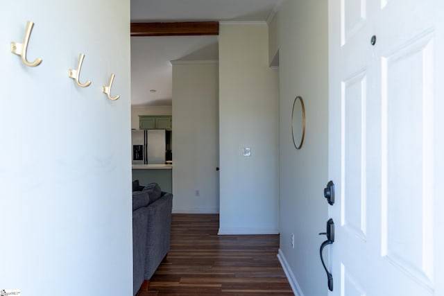 corridor featuring dark wood-type flooring and ornamental molding