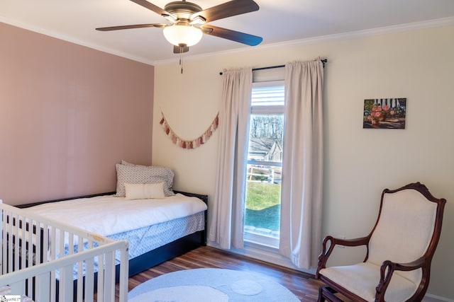 bedroom featuring hardwood / wood-style flooring, ceiling fan, crown molding, and access to exterior