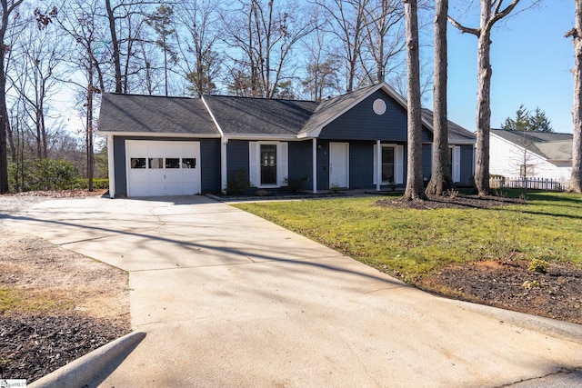 single story home featuring a front lawn and a garage