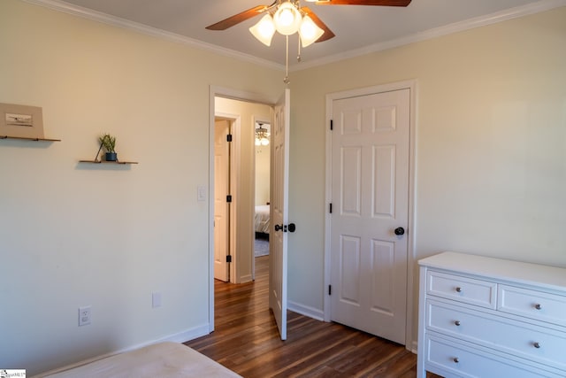 bedroom with ornamental molding, ceiling fan, and dark hardwood / wood-style floors