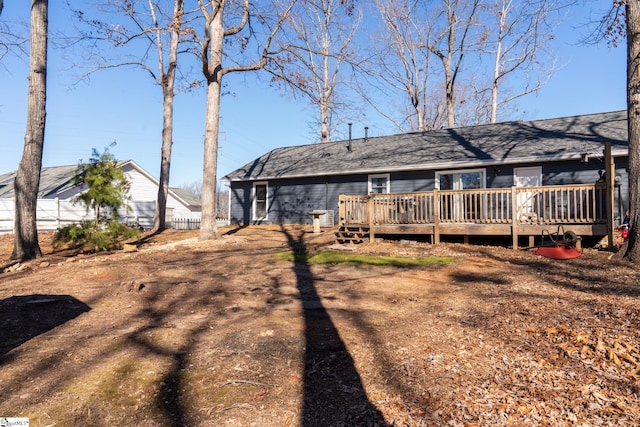 rear view of property with a deck