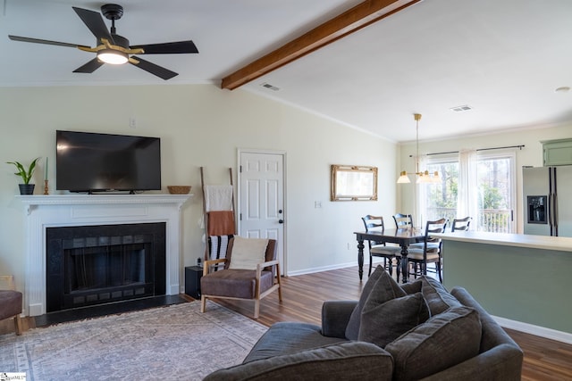 living room featuring hardwood / wood-style flooring, ceiling fan, lofted ceiling with beams, and ornamental molding