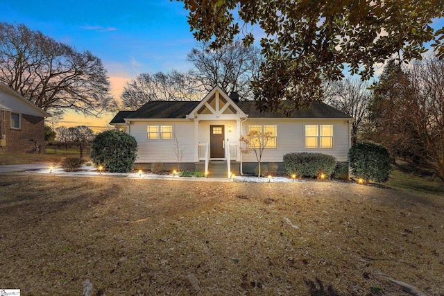 view of front of house with a lawn