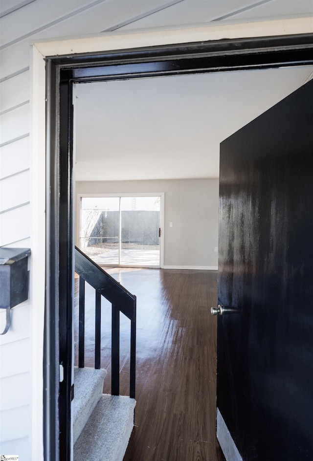 stairway with hardwood / wood-style floors