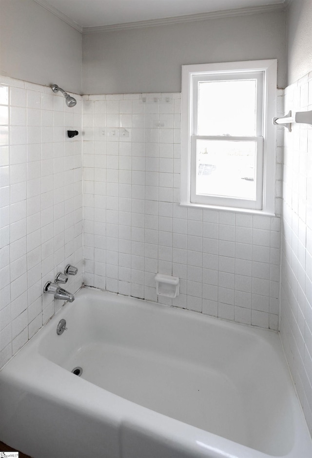 bathroom with shower / bath combination and ornamental molding