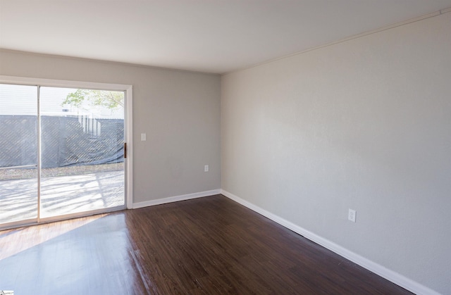 empty room featuring dark hardwood / wood-style floors