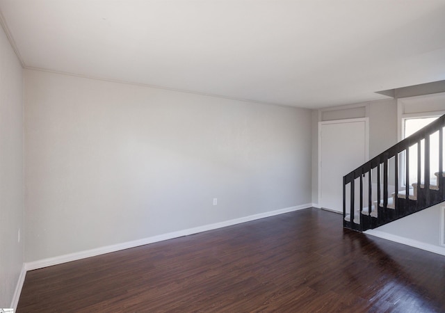 empty room featuring dark hardwood / wood-style flooring