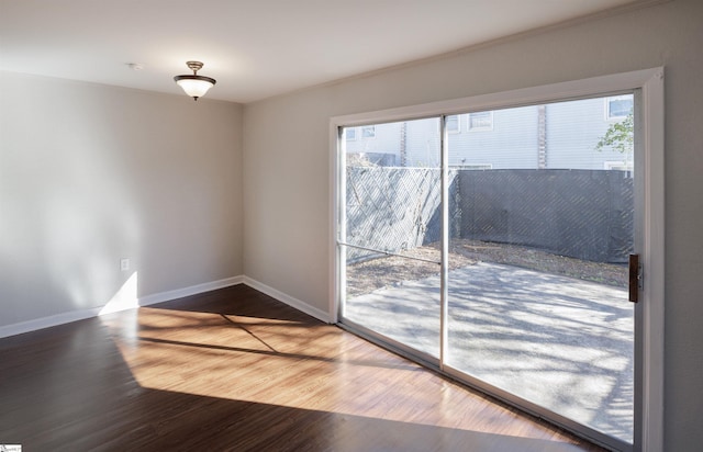 empty room with hardwood / wood-style flooring