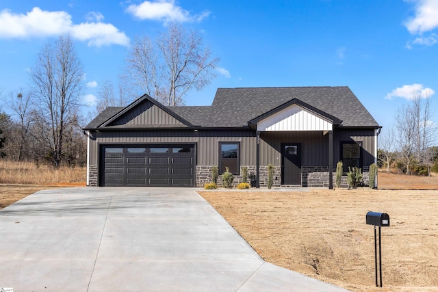 modern inspired farmhouse with a garage