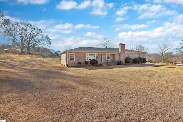 ranch-style home with a front lawn