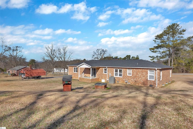 rear view of house with a lawn