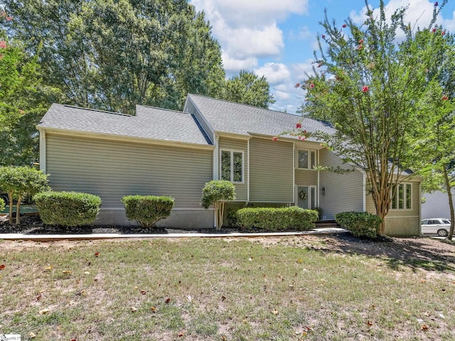 ranch-style home with a front yard