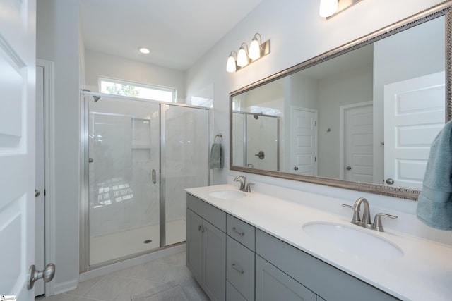 bathroom with an enclosed shower and vanity