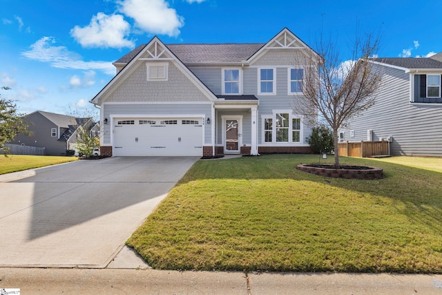 craftsman-style home featuring a front lawn and a garage