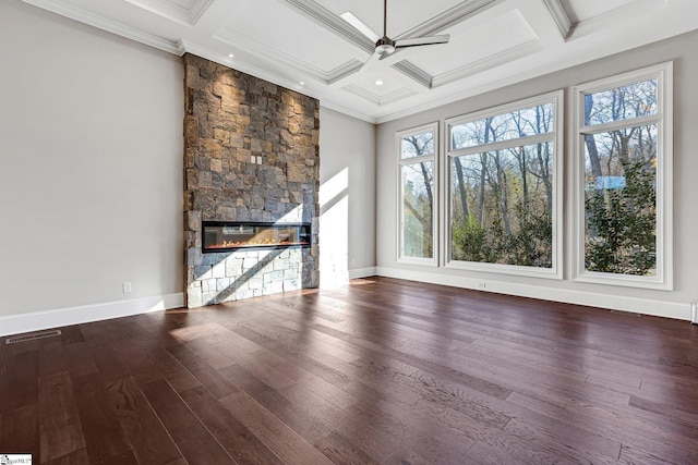 unfurnished living room featuring ceiling fan, beamed ceiling, coffered ceiling, and a fireplace