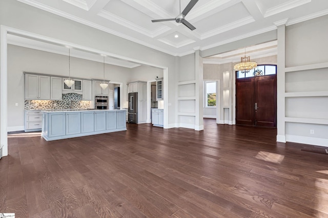 kitchen with stainless steel appliances, coffered ceiling, pendant lighting, crown molding, and beam ceiling