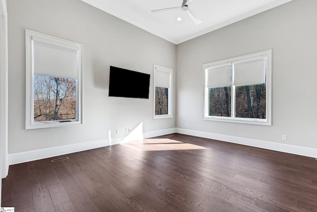 unfurnished living room with dark hardwood / wood-style flooring, ceiling fan, and ornamental molding