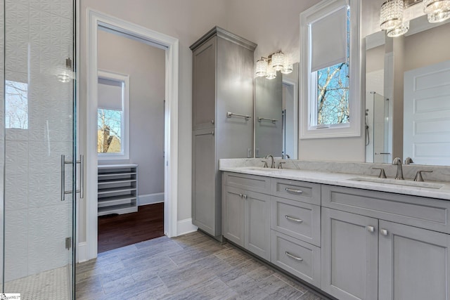 bathroom with an enclosed shower and vanity