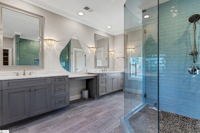 bathroom featuring vanity, walk in shower, and ornamental molding