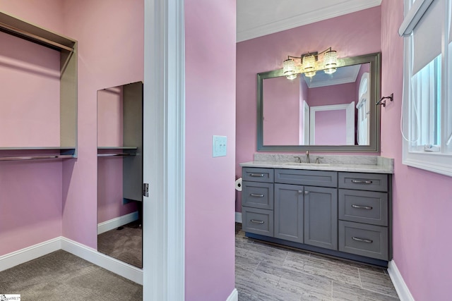 bathroom featuring vanity and crown molding