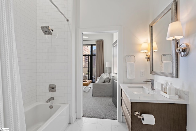 bathroom featuring shower / tub combo and vanity