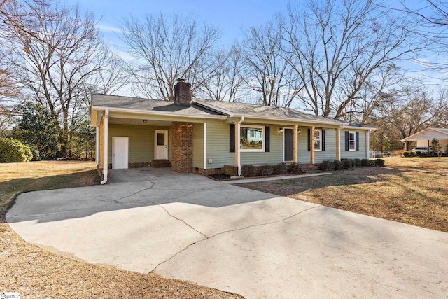 ranch-style house with a porch and a carport